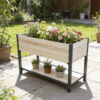 Natural wood raised garden bed with a black iron frame and lower shelf; plants and pots shown for styling.