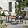 A pair of black PE rattan patio chairs showing their curved seats, open-weave backs and iron frames.