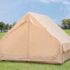 Khaki inflatable camping tent on grass, with the fabric entrance closed.